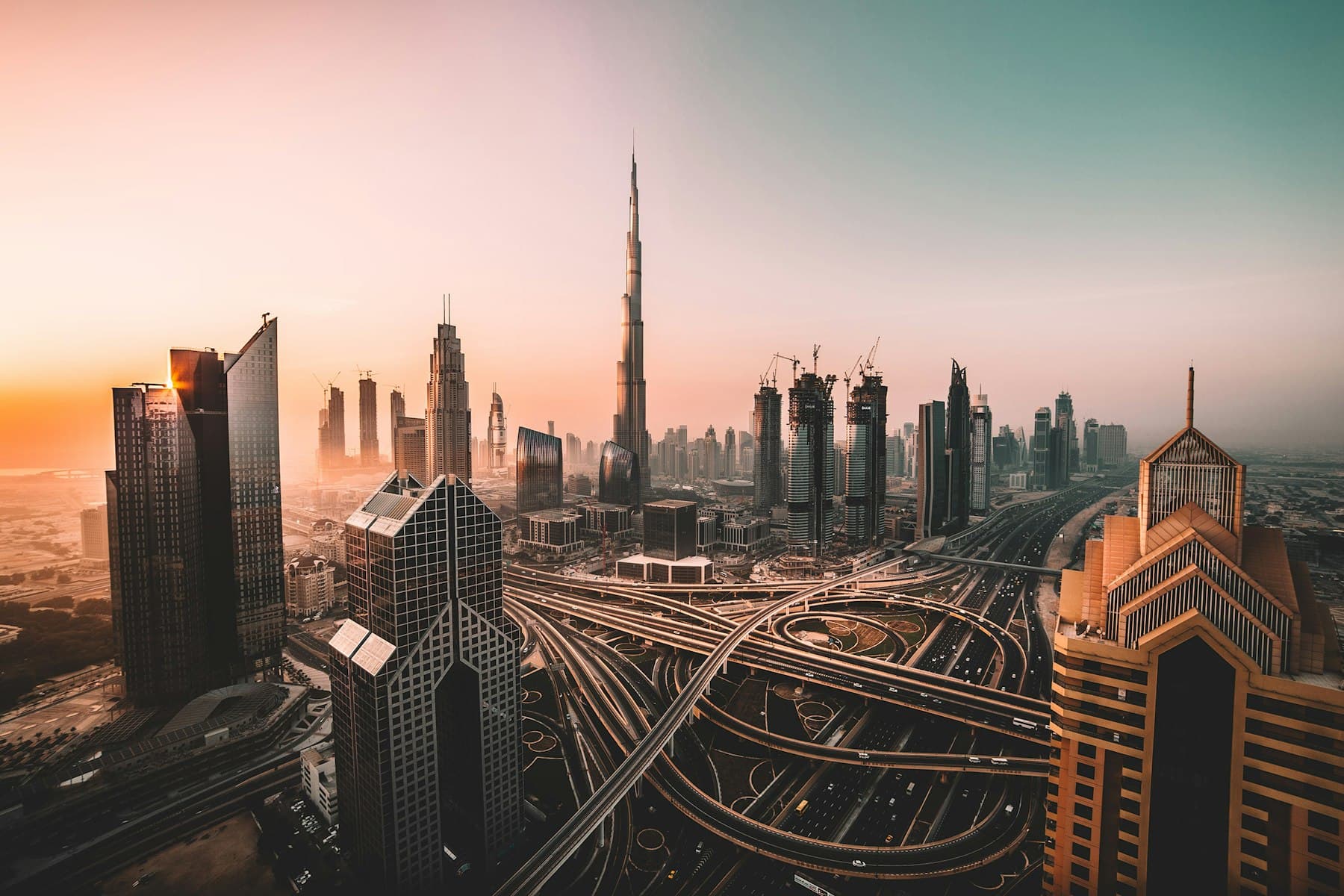 Dubai Downtown skyline with Burj Khalifa at sunset
